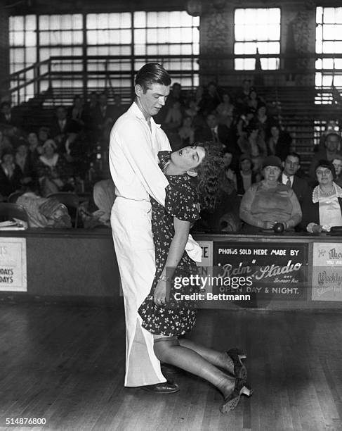 Frank Micholowsky holds his exhausted sister and dance partner Marie Micholowsky after a marathon dance competition.