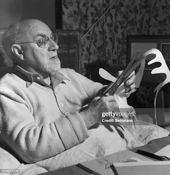 Henri Matisse working on paper cut out. Undated photo.
