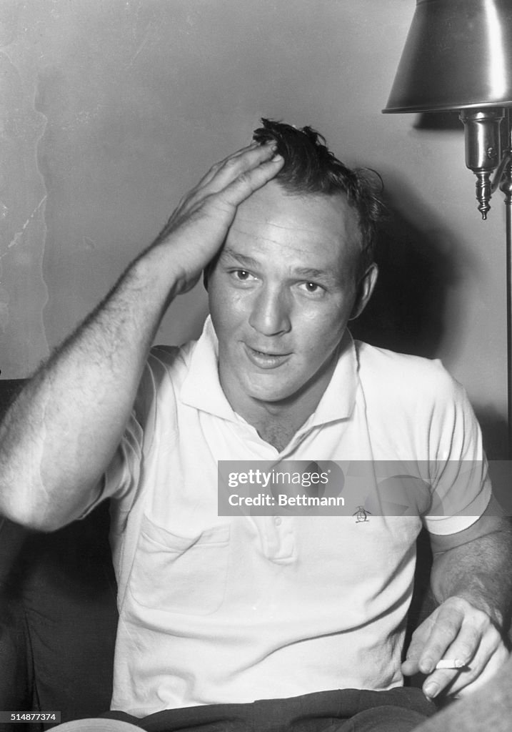 Arnold Palmer Brushing Back Hair