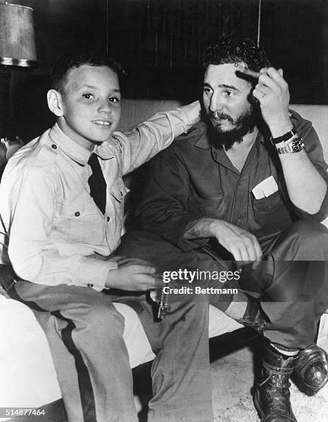 Havana, Cuba: Fidel Castro, Cuban President wiht his son, Fidelito in the Hotel Hilton in Havana. Phtograph ca. 1959.