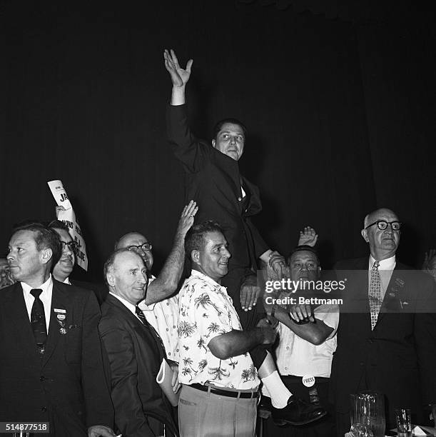 Miami Beach, FL: Newly-elected President of the International teamsters Union James R. Hoffa is carried on shoulders of delegates after winning the...