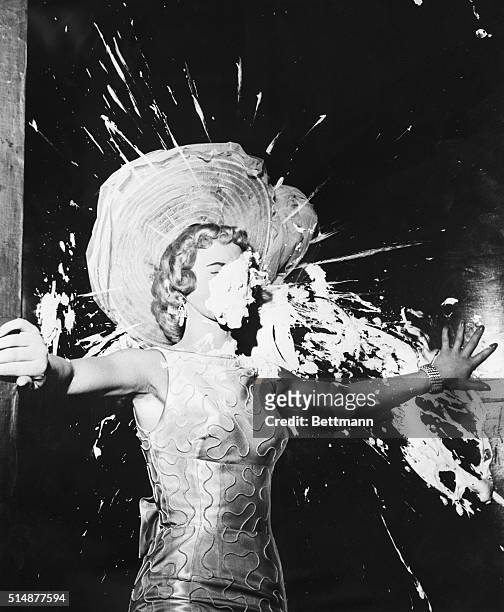 Dotty Harmony takes a pie in the face as she introduces comedian Ernie Kovacs, onstage at the Tropicana Hotel in Las Vegas.