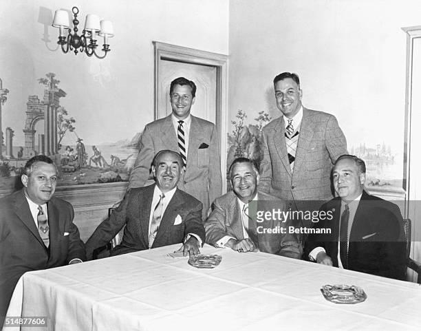 Studio executives of M-G-M. Seated, left to right: Ben Kalmenson, J.L. Warner, Mervyn Leroy and Steve Trilling; standing, William Orr and Jack M....