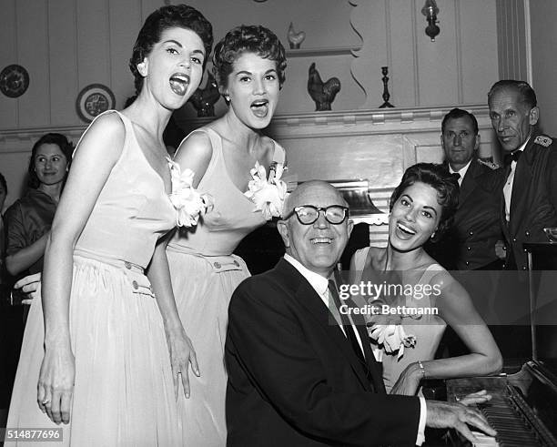 The McGuire Sisters singing with songwriter Jimmy McHugh at the piano. Undated photo.