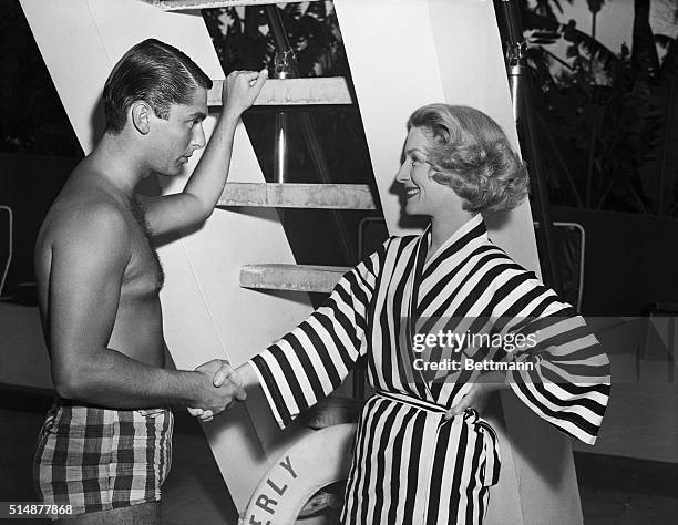 Hollywood, CA: Former actress Norma Sheer welcomes her "discovery" Robert J. Evans, a youthful vice president of a New York sports wear manufacturing...