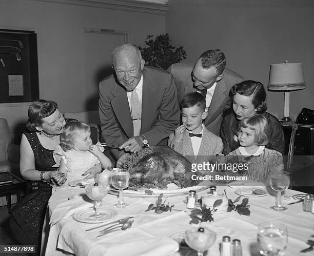Augusta, Georgia: President Eisenhower and his family enjoy a traditional Thanksgiving dinner at the president's vacation retreat at the Augusta,...