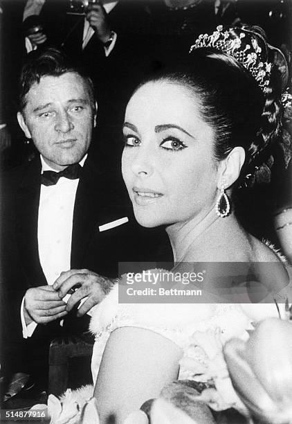 Paris, France: Elizabeth Taylor and Richard Burton attend the benefit premiere of the film "Lawrence of Arabia," here 3/15. The pair co-star in the...