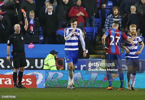 Jake Cooper of Reading is shown a red card by referee Mike Dean and is sent off during the Emirates FA Cup sixth round match between Reading and...