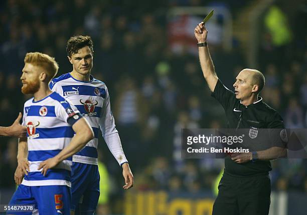 Jake Cooper of Reading is shown a red card by referee Mike Dean and is sent off during the Emirates FA Cup sixth round match between Reading and...