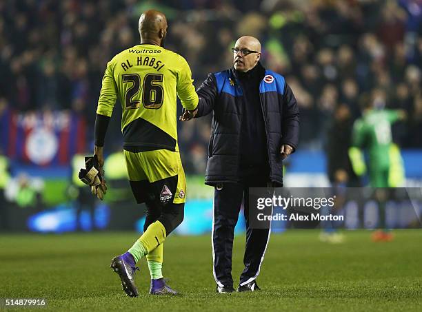 Brian McDermott manager of Reading and goalkeeper Ali Al-Habsi of Reading shake hands after the Emirates FA Cup sixth round match between Reading and...