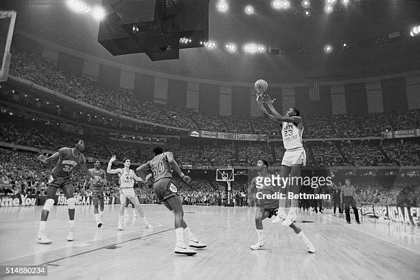 University of North Carolina basketball player Michael Jordan shoots the winning basket in the 1982 NCAA Finals against Georgetown University.