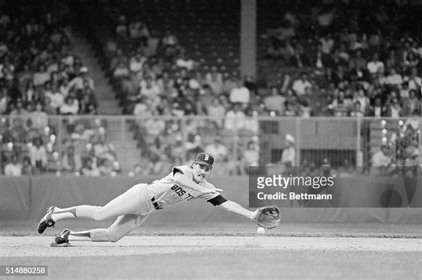 Boston Red Sox third baseman Wade Boggs dives for a groundball in a game against the Detroit Tigers.