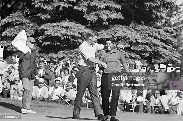 Bert Yancey congratulates fellow golfer Lee Trevino on his winning of the 1968 US Open in Rochester, New York.