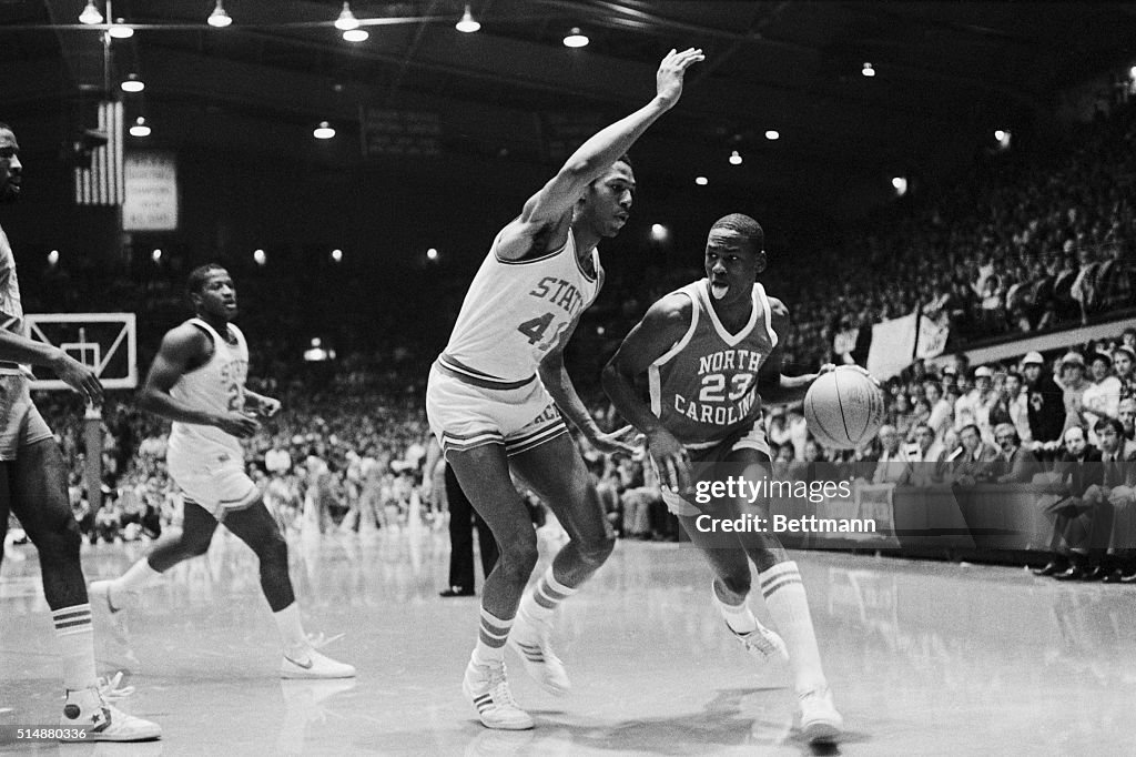 Michael Jordan Dribbling Past Defender