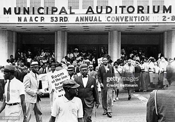 Demonstrators preparing to picket selected businesses in Atlanta leave the Atlanta Municipal Auditorium where the NAACP is holding its annual...