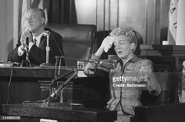 Los Angeles, California: Showing the strain, actress Lana Turner appears on the verge of collapse as she testifies at the inquest into the death of...