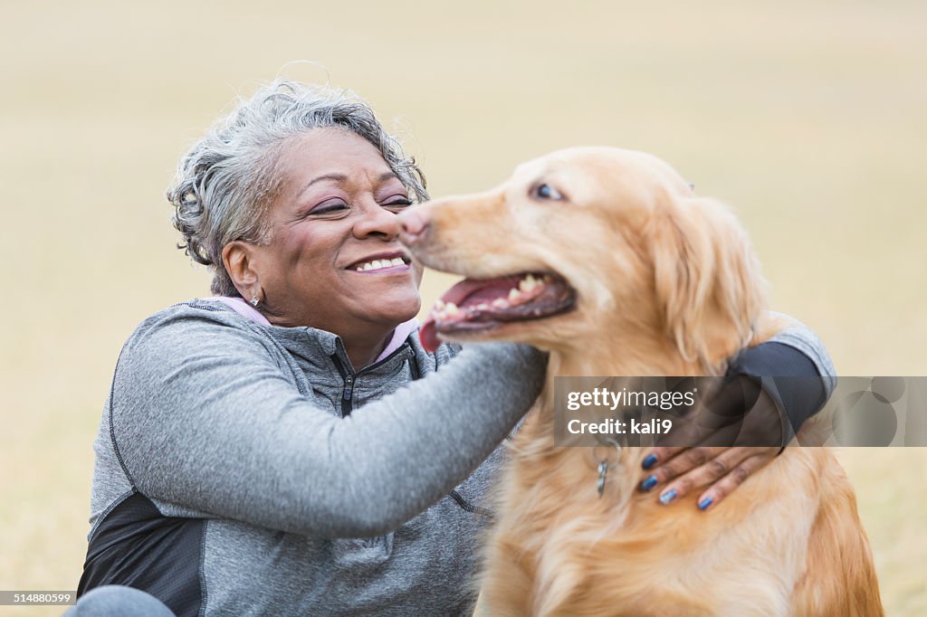 African American woman with pet dog