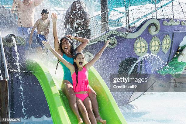 family at water park - water slide bildbanksfoton och bilder