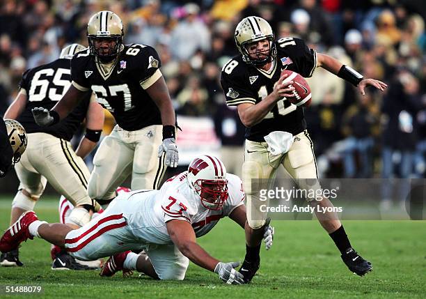 Kyle Orton of Purdue runs with the ball against Wisconsin during the game at Ross-Ade Stadium on October 16, 2004 in West Lafayette, Indiana.