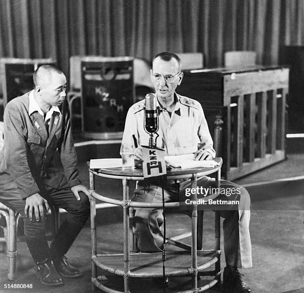 Philippines: Watched closely by a minor Japanese officer Lt. General Jonathathan M. Wainwright is shown broadcasting his appeal to the scattered...