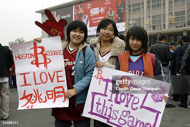 Fans line up to enter Beijing Capital Stadium for the preseason game between the Houston Rockets and the Sacramento Kings October 17, 2004 in...