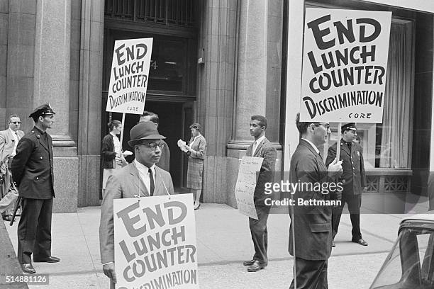 New York, NY: Kress Picketed - pickets representing the Congress of Racial Equality , give handbills to passerbys as they patrol before the building...