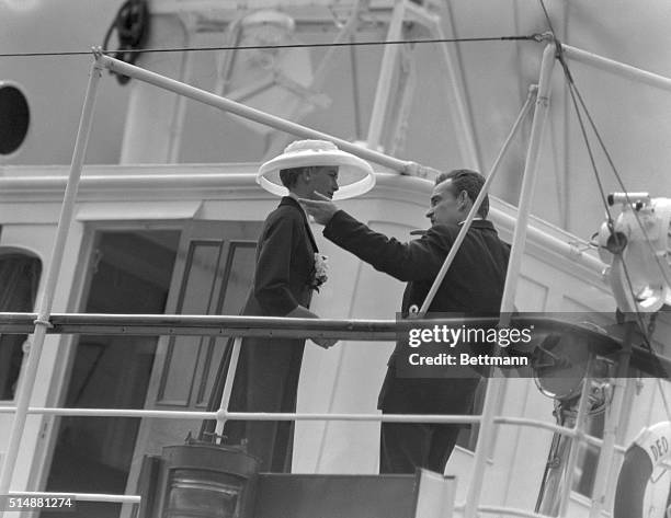 Monaco: Monaco's prince Rainier III greets his future Princess, Grace Kelly, as she steps aboard his Yacht from the U.S.S. Constitution on which she...