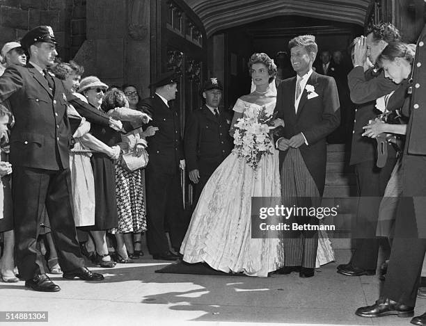 Mr. And Mrs. John F. Kennedy and wedding party after church ceremony. Photo.