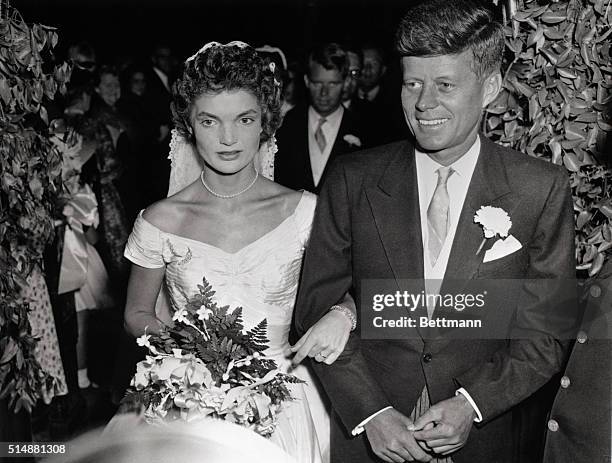 John F. Kennedy and Jacqueline Lee Bouvier wed on September 12 in St. Mary's Church in Newport, Rhode Island, USA.