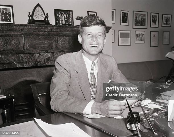 Washington, DC: grinning happily here is Sen. John F. Kennedy of MA.,called the Senate's "most eligible Bachelor", who is going to surrender that...