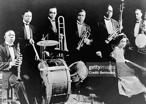 Joe "King" Oliver and his Creole Jazz Band pose in their studio in Chicago, ca. 1922. The band, which had a lifespan of just four years, was one of...