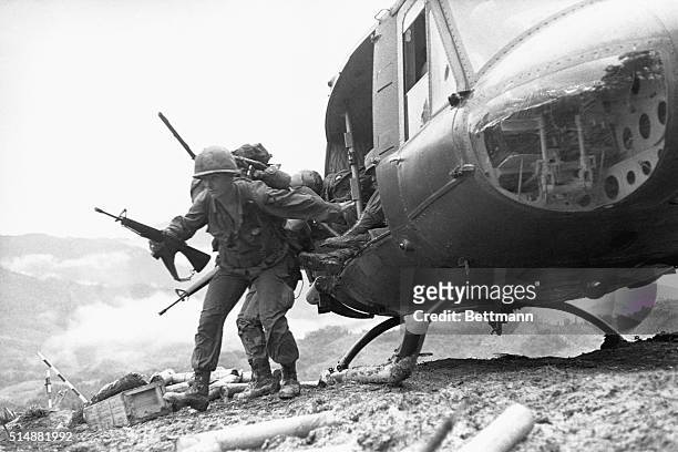 Paratroopers jump out from a helicopter to assist in fighting at Dong Ap Bia, which became known as "Hamburger Hill" in the A Shau Valley in South...