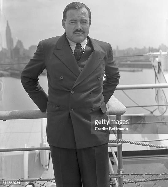 New York: Ernest Hemingway, famous author who seems always in quest of adventure pictured on the S.S. Normandie on his return to America today May...