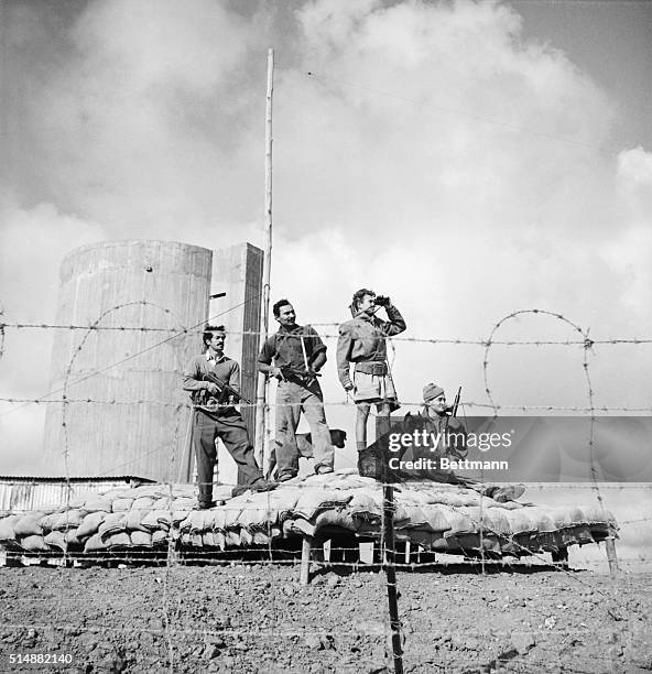 Jerusalem, Israel: Guarding the Jewish settlement in the Negev. This photo shows a group of Haganah Youths on guard with their dogs at a defense post...