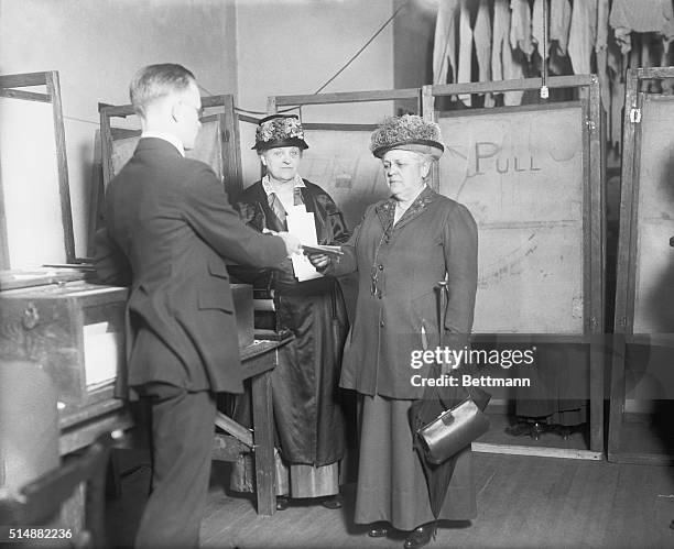 Noted suffrage leaders cast their votes for president. Left to right:- Mrs. Carrie Chapman Catt and Miss Mary Garrett Hay, identified with the...