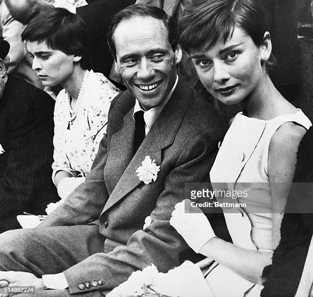 Madrid, Spain: Mel Ferrer and his actress wife, Audrey Hepburn are shown as they attended thier first bullfight in Madrid. At left is Lucia Bose,...