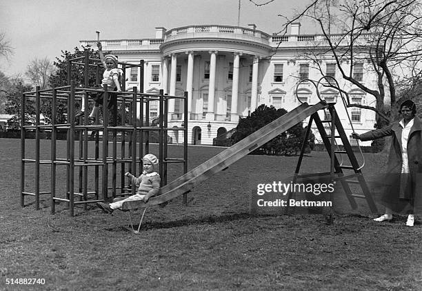 Curtis Boettiger and Anna Eleanor Boettiger , the grandchildren of President Franklin and Eleanor Roosevelt, play on a playground on the South Lawn...