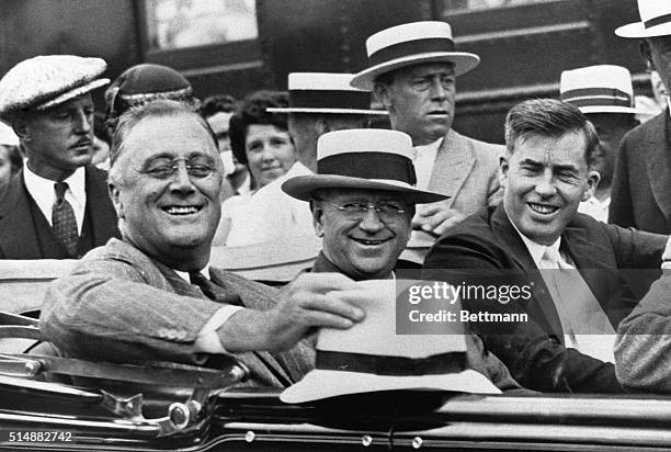 President Franklin D. Roosevelt rides in an automobile with Secretary of the Interior Harold L. Ickes , and Secretary of Agriculture Henry A. Wallace...