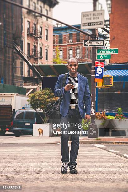 young adult commuter going at work in the city streets - new york fashion week stockfoto's en -beelden