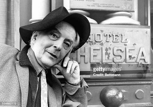 Gay writer Quentin Crisp, noted for his autobiography, The Naked Civil Servant, stands in front of the Hotel Chelsea in New York, New York. |...