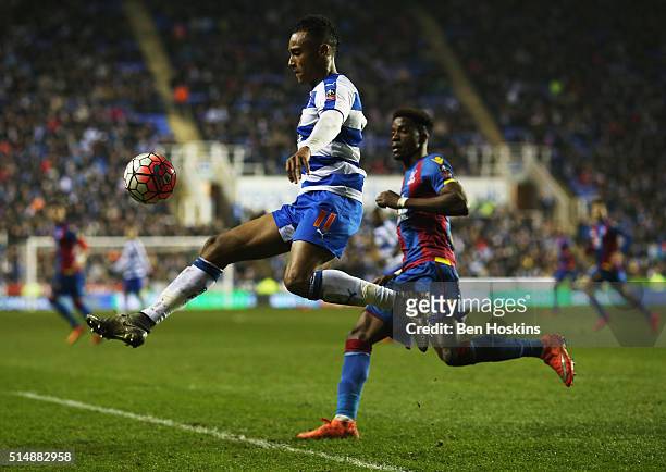 Jordan Obita of Reading beats Wilfried Zaha of Crystal Palace to the ball during the Emirates FA Cup sixth round match between Reading and Crystal...