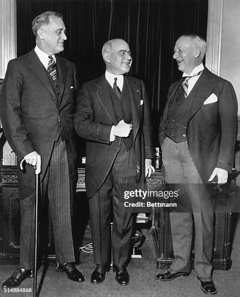 Newly-elected governor of New York Franklin Delano Roosevelt stands with his lieutenant governor, Herbert Lehman and the state's previous governor,...