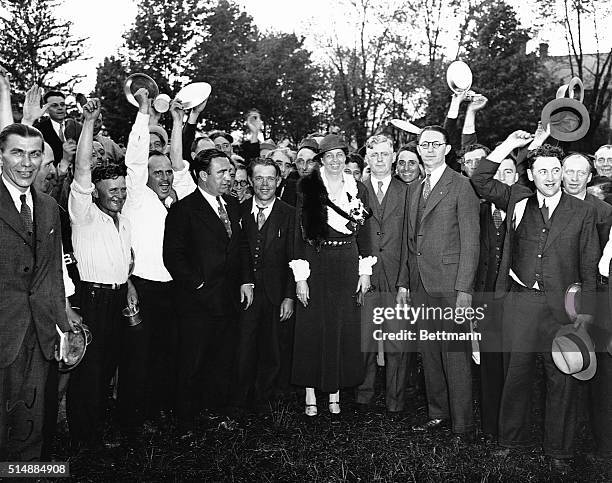 First Lady Eleanor Roosevelt is a popular visitor to the new Bonus Army camp at Fort Hunt, Virginia. Mrs. Roosevelt is being lustily cheered by the...