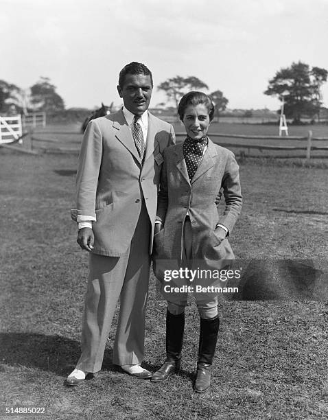 Southampton, L.I., NY: Mr. And Mrs. J. V. Bouvier the Third at a horse show in Southampton, L.I.