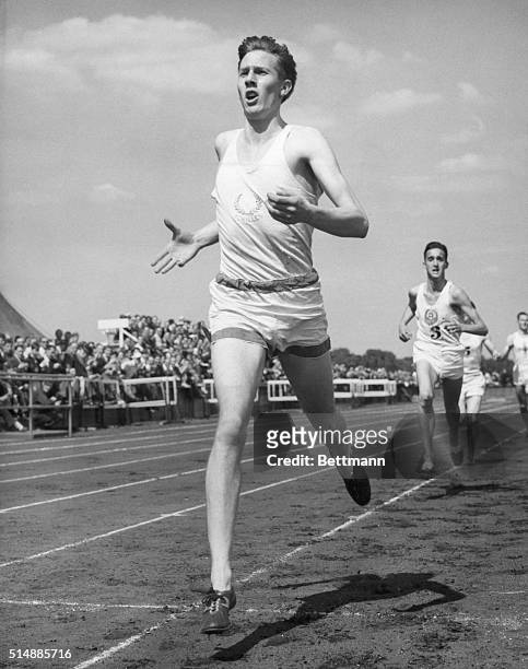 Roger Bannister, American athlete, winning mile race. Photograph, 1951.