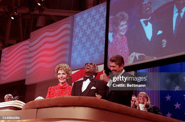 Dallas, TX: President Ronald Reagan leans over and thanks singer Ray Charles 8/23. Charles sang "America the Beautiful" at the GOP Convention. Nancy...