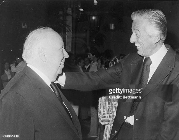 Lew Wasserman, Chairman and C.E.O. Of MCA-Universal, congratulates Alfred Hitchcock on the completion of Family Plot, at the film's wrap party. North...