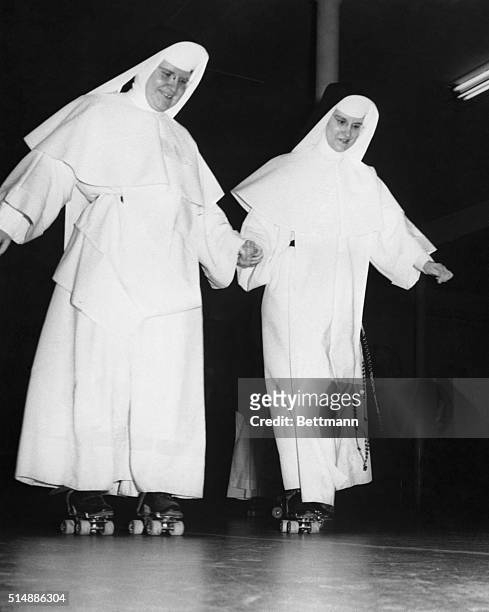 Taking time out from their teaching duties, nuns go roller skating at a social center here, March 30th. They are Sister Lawrence Marie and Sister...
