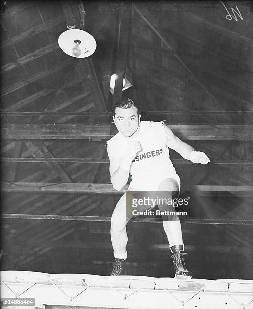 Boxer Barney Ross during workout at his training camp in Grossinger, New York. | Location: Grossinger Lake, New York State, USA.