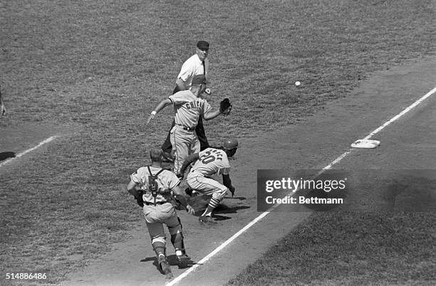 The Cardinals' Lou Brock stole home on double steal attempt after being caught between 3rd and home, when Cubs' catcher Jim Schaffer overthrew to 3rd...